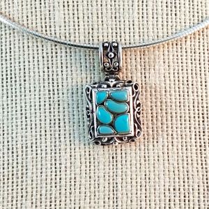 Turquoise stones pendant inlaid in 925 sterling silver scroll detail